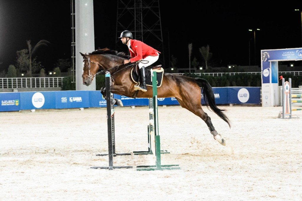 Night show jumping under arena lights